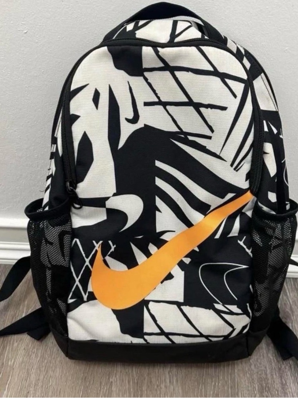 Nike Men’s Black & White Graphic Backpack with Orange Swoosh Accent